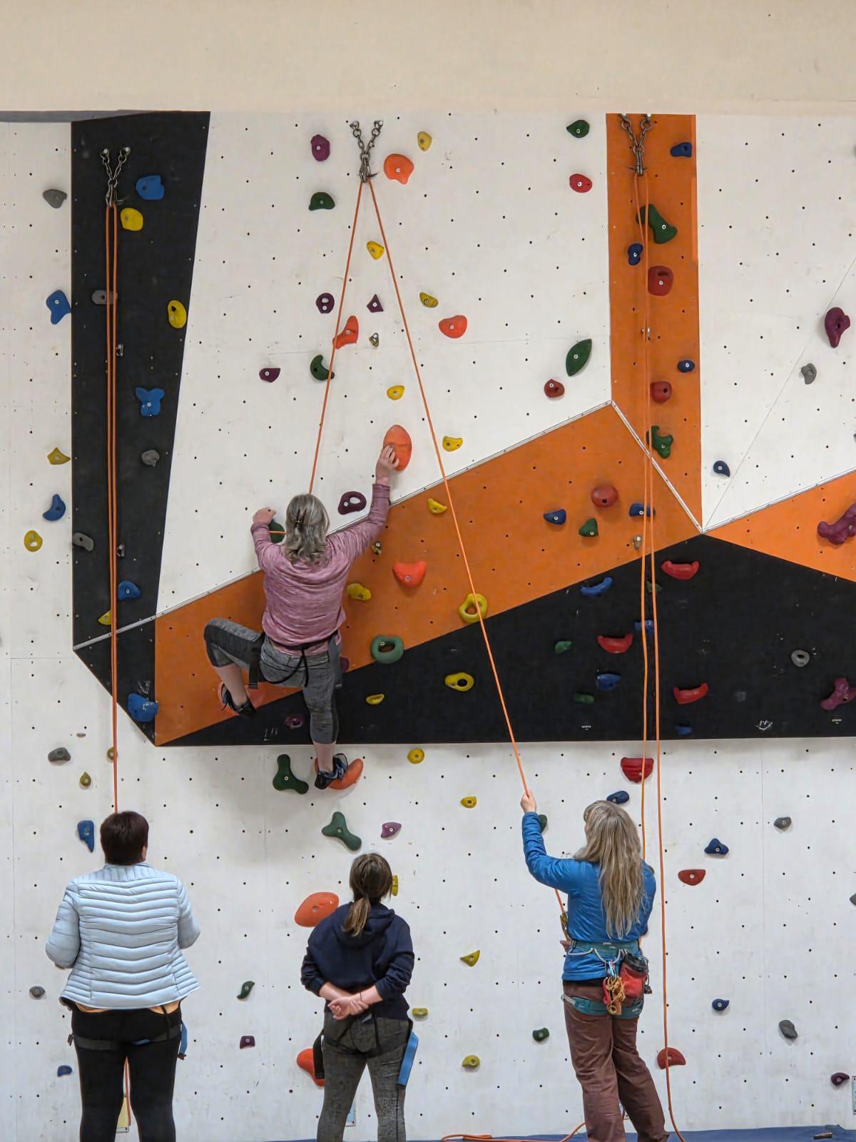 A photo of women climbing indoors in Cumbria